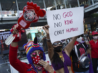 Protesters holds a banner during a demonstration calling for the abolition of the section 112 criminal code lese majeste law in Bangkok, Tha...