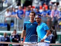 Fabio Fognini of Italy and Andy Murray of Great Britain during day three of the Davis Cup World Group Quarter Final match between Italy and...