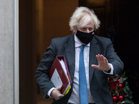 LONDON, UNITED KINGDOM - DECEMBER 15, 2021: British Prime Minister Boris Johnson leaves 10 Downing Street for PMQs at the House of Commons o...