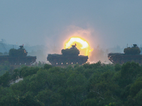 M60-A3 tanks fire cannons during  a live ammunition military drill at an unnamed  location, amid rising tensions with China, in Hsinchu, Tai...