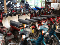Visitors see a row of old motorcycles for purchase and replacement of antique motorcycle parts that are being restored at the old Motorcycle...