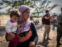 Syrian refugee wait to cross the border between Macedonia and Greece near the Macedonian town of Gevgelija, on August 26, 2015.
The EU is gr...