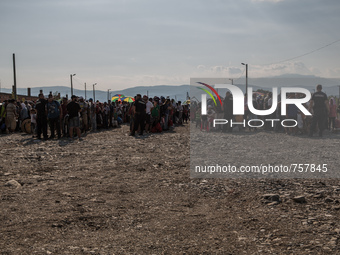 Migrants wait the train for Serbia, near the Macedonian town of Gevgelija, on August 26, 2015. The EU is grappling with an unprecedented inf...