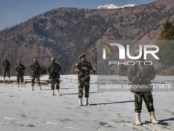 Border Security Force (BSF) soldiers stand alert at a forward post in Baramulla, Jammu and Kashmir, India on 31 December 2021. Irrespective...
