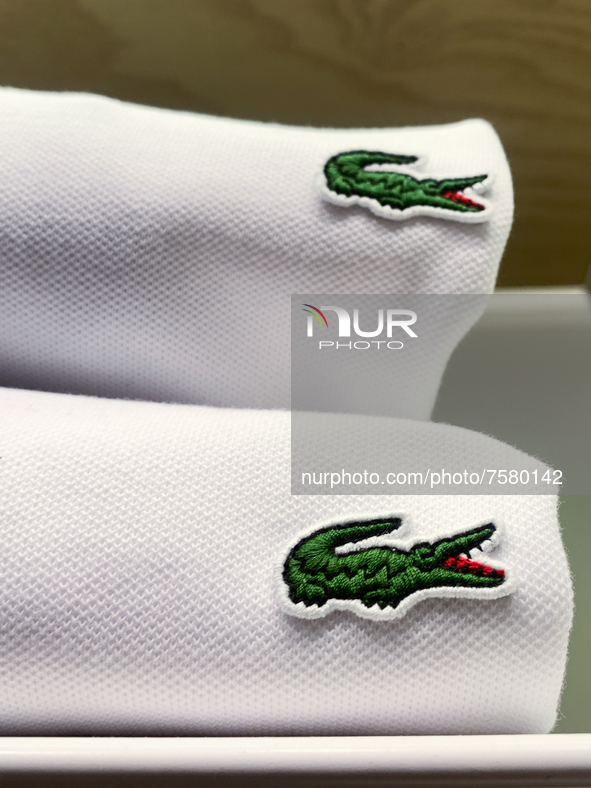 Lacoste logos are seen on clothes at the store in Krakow, Poland on December 30, 2021. 