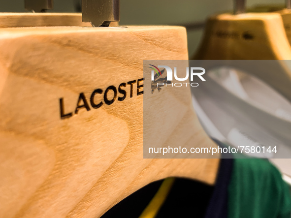 Lacoste logo is seen on clothes hanger at the store in Krakow, Poland on December 30, 2021. 