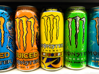 Monster energy drinks cans are seen at the shop in Krakow, Poland on December 31, 2021. (