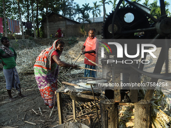 Workers making sugarcane juice to production of Gur (jaggery) in a village on December 10, 2021 in Barpeta, Assam, India. Gur (jaggery) is a...