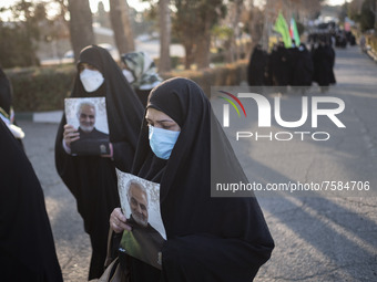 Iranian veiled women carrying portraits of the Iranian top IRGC commander, General Qasem Soleimani who was killed in a U.S. drone attack in...