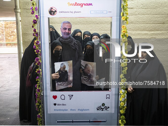 Iranian veiled women pose for photographs with an effigy of the Iranian top IRGC commander, General Qasem Soleimani who was killed in a U.S....