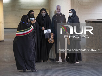 Iranian veiled women pose for photographs with an effigy of the Iranian top IRGC commander, General Qasem Soleimani who was killed in a U.S....