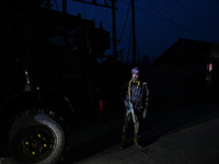 An Indian paramilitary trooper stands near the encounter site on the outskirts of Srinagar, Indian Administered Kashmir on 03 January 2022....
