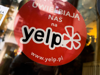 Yelp sticker is seen on the cafe in Krakow, Poland on January 1, 2022. (