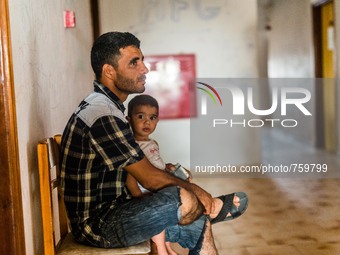 Refugee man and his chid on 30th August 2015 in Kos Island, Greece.
Kos on the brink as Mediterranean refugee crisis continues with many bo...
