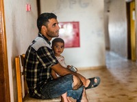 Refugee man and his chid on 30th August 2015 in Kos Island, Greece.
Kos on the brink as Mediterranean refugee crisis continues with many bo...