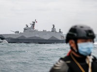 A Taiwanese military corvette sails as a Navy soldier stands guard on a vessel, during a Navy Drill for Preparedness Enhancement ahead of th...