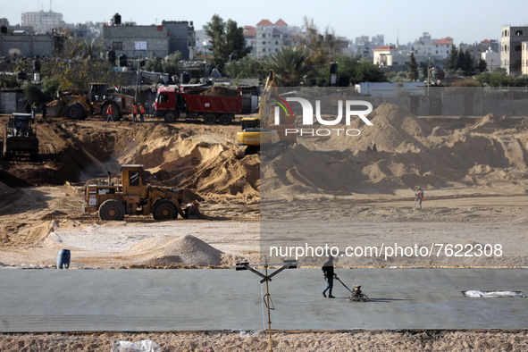 Egyptian machinery work at the construction site of a new housing complex north of Gaza City on January 11, 2022. - Egypt is making its pres...