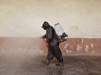 A worker sanitises the facilities of the Cathedral of San Bernardino de Siena in Xochimilco, Mexico City, following the increase in COVID-19...