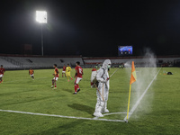 Workers sprays disinfectant to a corner pole during half time of FIFA friendly match between Indonesia against Timor Leste amid Covid-19 pan...