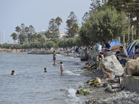 Migrants site with camping tents along the sea side walks in Kos Town, on the Greek island of Kos, on September 7, 2015. The head of the Eur...