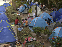 Migrants camp near the Byzantine Antimachia Castle in Kos Town, on the Greek island of Kos, on September 7, 2015. The head of the European U...