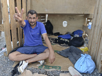 Beder, a migrant from Syria, in Kos harbor, on the Greek island of Kos, on September 7, 2015. The head of the European Union's executive say...