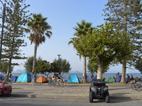 Migrants camp on the sea side in Kos Town, on the Greek island of Kos, on September 7, 2015. The head of the European Union's executive says...