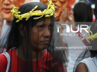 MANILA, Philippines - A protester in costume takes part during a protest rally in Manila on 08 April 2014. Hundreds of typhoon survivors too...