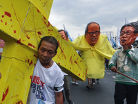 MANILA, Philippines - 58 year old typhoon victim, Londoy Mabag re-enacts the carrying of the cross to symbolize the sufferings of the typhoo...