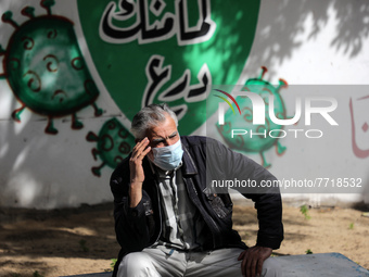 A Palestinian man waits for the result of his coronavirus test outside the Al-Shefa Hospital, in Gaza City, Feb. 2, 2022. 
 (