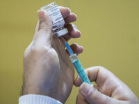 An Iranian health personnel loads a syringe with the South Korea AstraZeneca new coronavirus disease (COVID-19) vaccine during the mass gene...