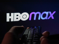TV remote control is seen with HBO Max logo displayed on a screen in this illustration photo taken in Krakow, Poland on February 6, 2022. (