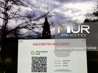 Vaccinated Welcome information is seen on a restaurant which is open for people who have EU COVID. Krakow, Poland. February 5, 2022. (