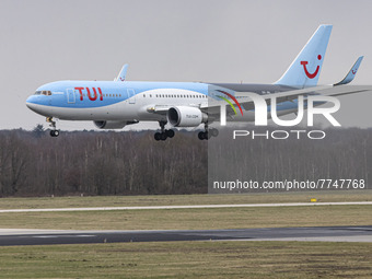 TUI Airlines Belgium Boeing 767-300ER aircraft as seen on final approach flying, landing on the runway and taxiing at Eindhoven Airport EIN...