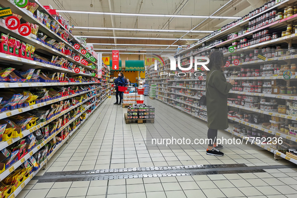 Grocery shopping in Auchan supermarket in Krakow, Poland on February 9, 2022.  