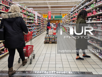 Grocery shopping in Auchan supermarket in Krakow, Poland on February 9, 2022.  (