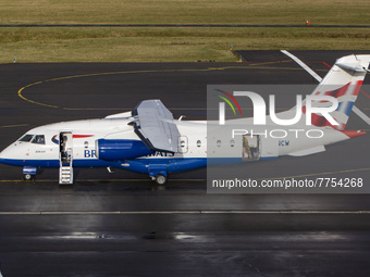 Passenger boarding in the regional airliner. British Airways Dornier Do-328JET-300 aircraft as seen in Eindhoven airport EIN during the taxi...