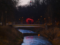 St. Valentine's Day decorations are seen on a footbridge over Klodnica River in Gliwice, Poland on February 14, 2022.  (