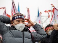 Farmers shout slogans during the National Farmers' Congress hold in front of the Korea Development Bank in Yeouido, Seoul, on February 25 20...