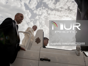 Vatican City : Pope Francis accompanied by his security agents, waves to faithful upon his arrival on St Peter's square at the Vatican to le...