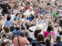 Vatican City : Pope Francis accompanied by his security agents, waves to faithful upon his arrival on St Peter's square at the Vatican to le...