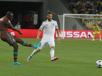 Bruno Martins Indi (L) of Porto hits a ball during the UEFA Champions League Group G stage football match between FC Dynamo Kyiv and FC Port...