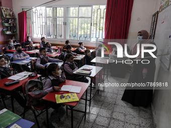Palestinian students attend a class at a private school in Gaza City, on March 6, 2022. (