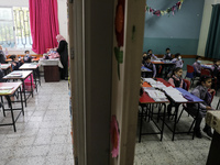 Palestinian students attend a class at a private school in Gaza City, on March 6, 2022. (
