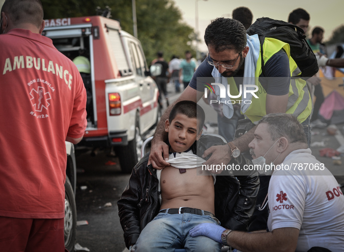 An injured migrant near  "Horgos 2" border crossing into Hungary, on September 16, 2015. UN Secretary-General Ban Ki-moon on Wedne...