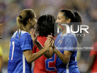 US Forward Christen Press (right) is congratulated by US Midfielder Tobin Heath after Press scored a goal in the 33rd minute in the Internat...