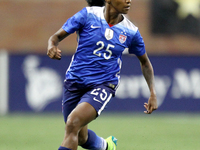 US defender Crystal Dunn carries the ball up there field during the first half of the International Friendly match between the United States...