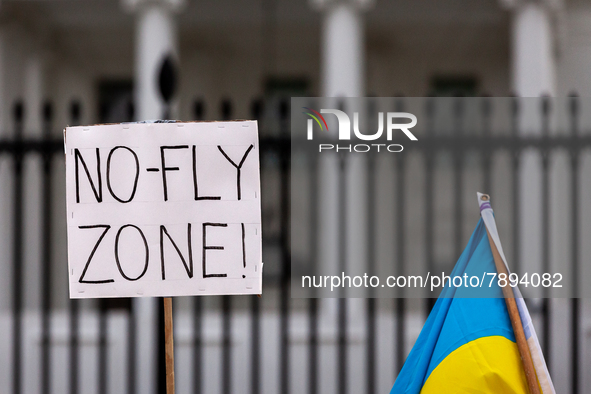 A sign demands a no-fly zone for Ukraine on the 15th consecutive day of protests at the White House, marking two weeks since the Russian inv...