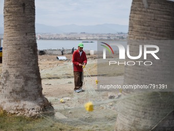 A man repairing a net fisherman in the port of Coquimbo, Chile, on 19 September 2015 was destroyed by tsunami waves of up to 4.5 meters that...