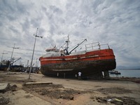 A fishing boat that was ran aground by the sea while berthed in the port of Coquimbo, some 445 km north of Santiago, during the eve's earthq...